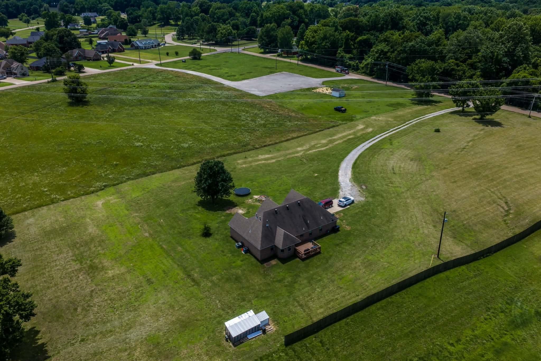 4776 Campground Road Munford, TN 38058 - Photo 24 of 25 a view of a golf course with a swimming pool
