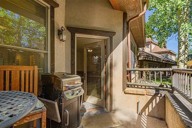 a view of a chairs and table in the balcony