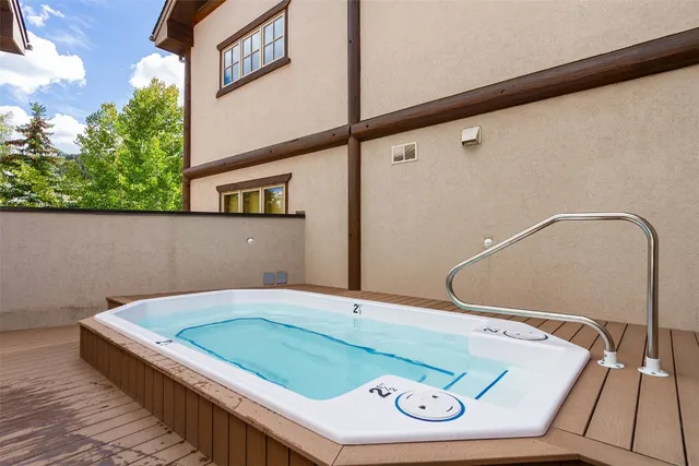 a bathroom with a shower and a sink