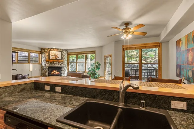 a kitchen with a sink stove top oven and refrigerator