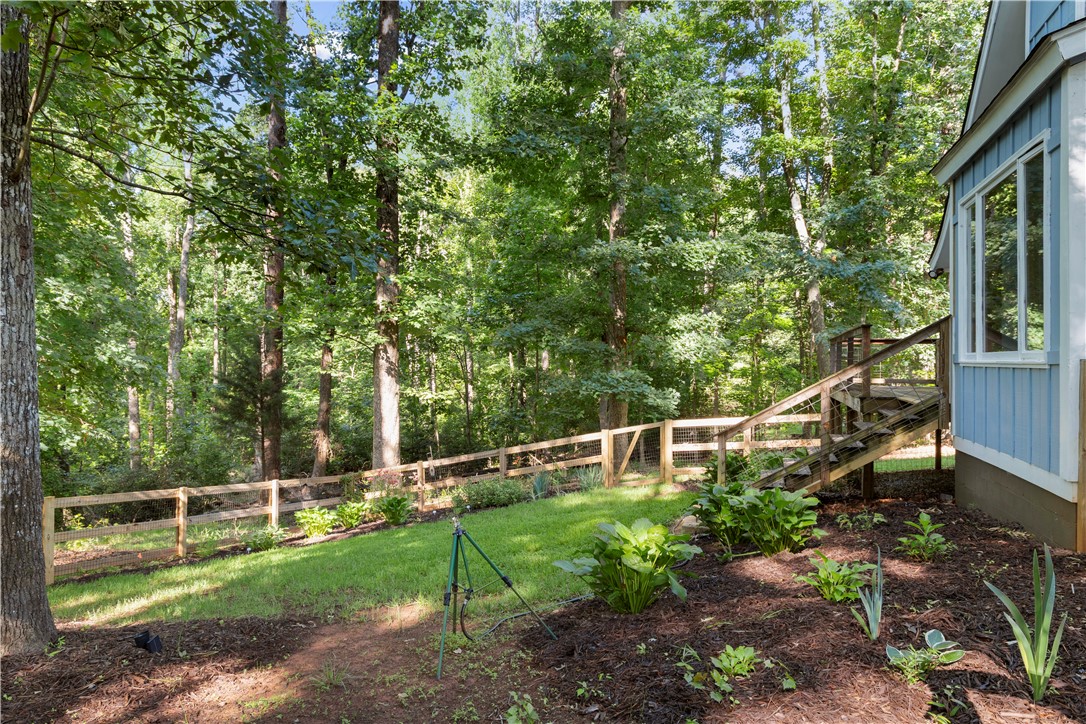 1298 Carradine Road Seneca, SC 29678 - Photo 35 of 43 Natural wood fencing, mature trees, and beautiful landscaping.