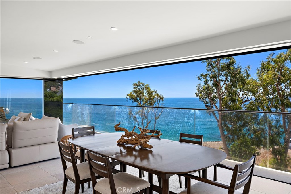 2629 Victoria Drive Laguna Beach, CA 92651 - Photo 11 of 35 a view of a dining room with furniture and wooden floor