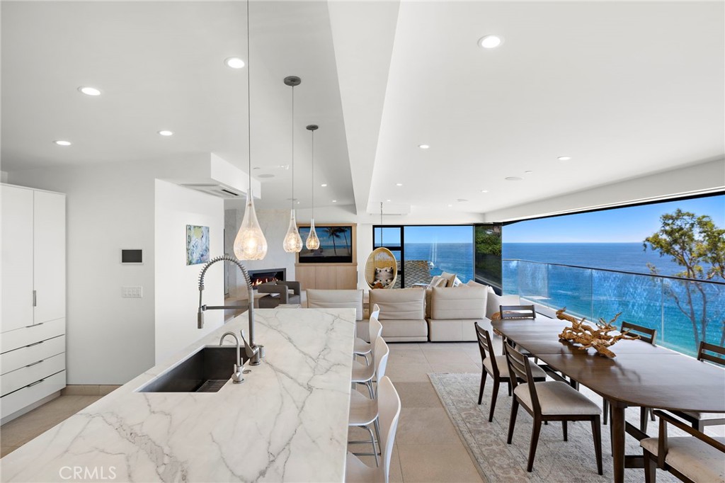 2629 Victoria Drive Laguna Beach, CA 92651 - Photo 12 of 35 a living room with furniture a fireplace and a table
