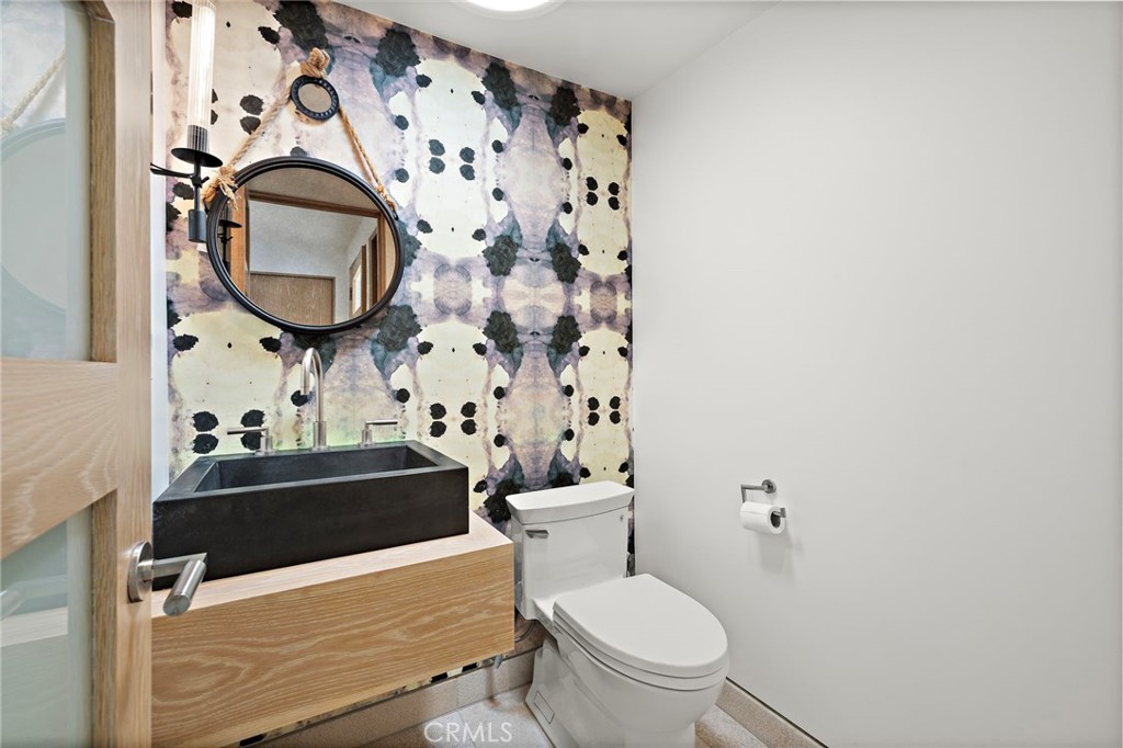 2629 Victoria Drive Laguna Beach, CA 92651 - Photo 16 of 35 a bathroom with a toilet sink and mirror