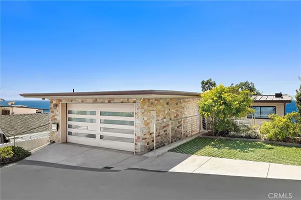 a view of a house with a garage