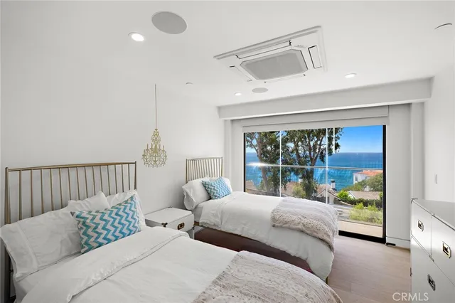 a bedroom with a large bed and a large window