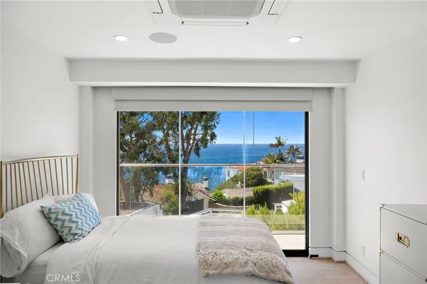 a bedroom with furniture and a fireplace