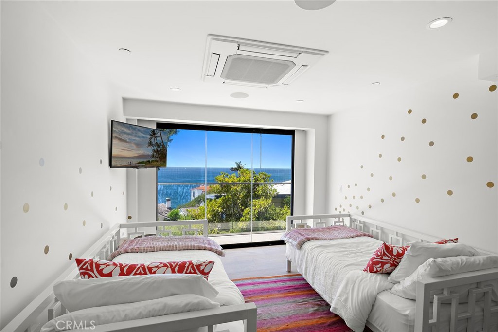 2629 Victoria Drive Laguna Beach, CA 92651 - Photo 23 of 35 a bed room with a bed and a couch