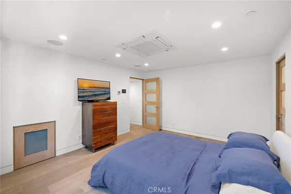 a bed room with a bed and a television