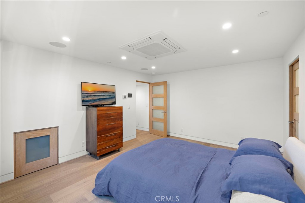 2629 Victoria Drive Laguna Beach, CA 92651 - Photo 26 of 35 a bed room with a bed and a television