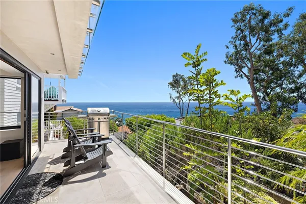 a view of a balcony with chairs