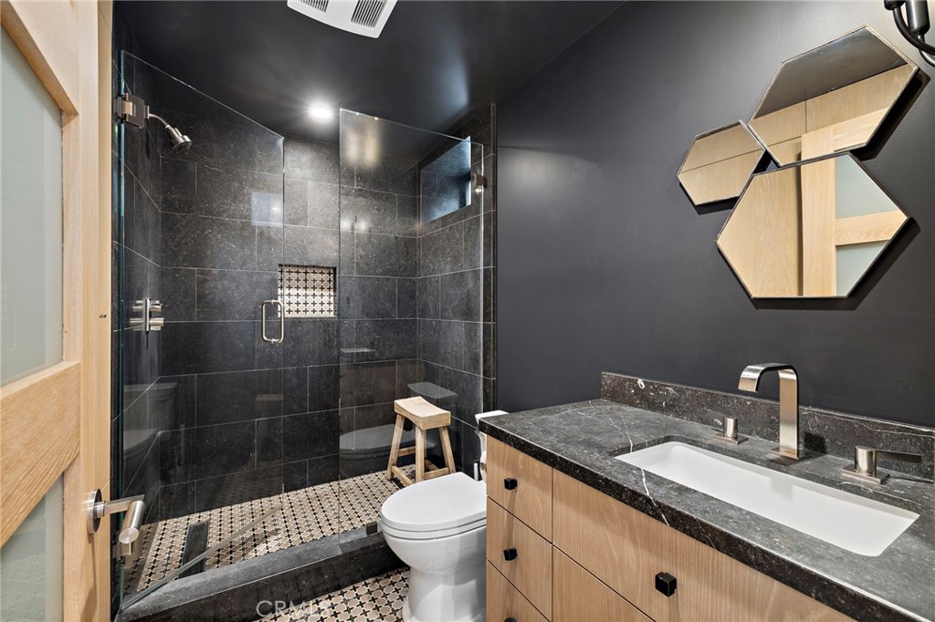 2629 Victoria Drive Laguna Beach, CA 92651 - Photo 30 of 35 a bathroom with a sink toilet and shower