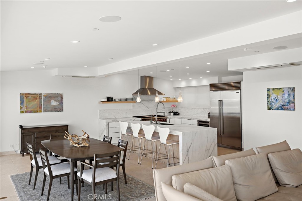 2629 Victoria Drive Laguna Beach, CA 92651 - Photo 7 of 35 a living room with stainless steel appliances kitchen island granite countertop a dining table and chairs