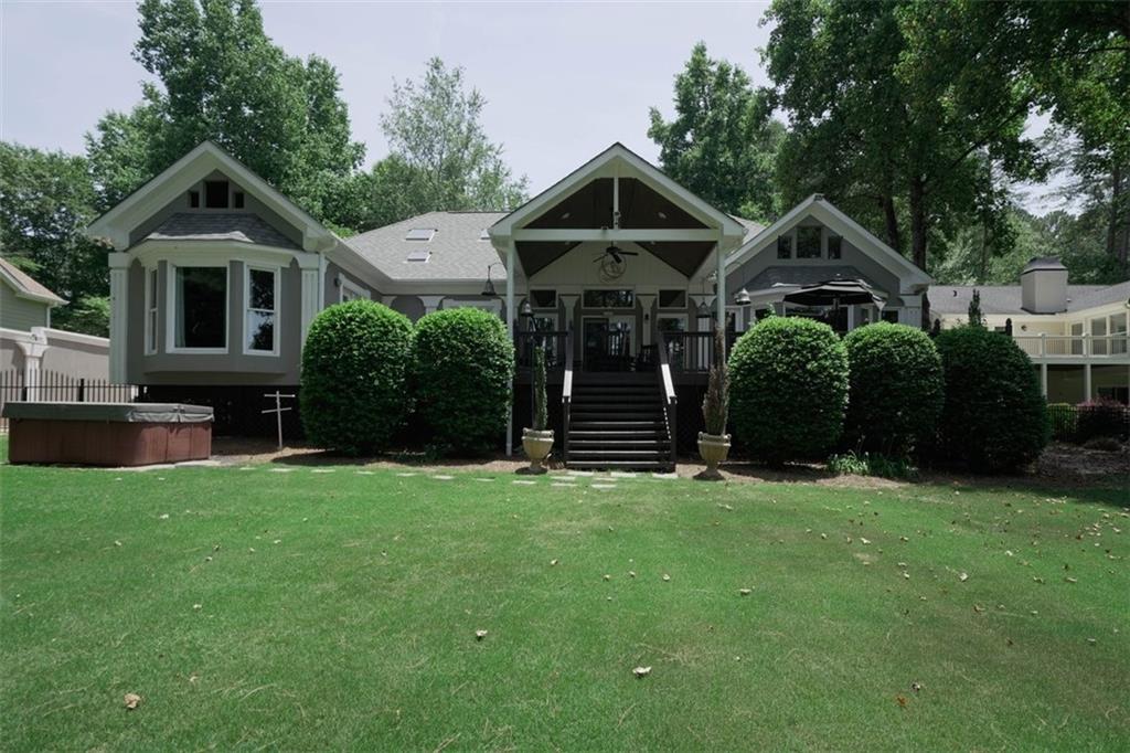 3735 T W Henderson Road Cumming, GA 30041 - Photo 1 of 1 a front view of a house with a yard
