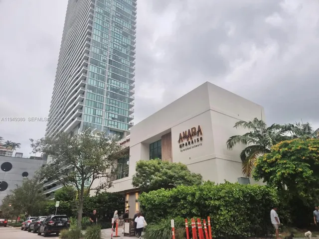 a front view of a building with garden