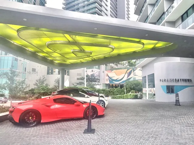 a view of an swimming pool with a patio and yard of the house