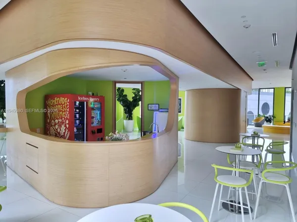 a living room with furniture and a swimming pool