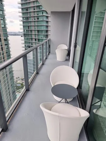 a bathroom with a sink a toilet a mirror and shower