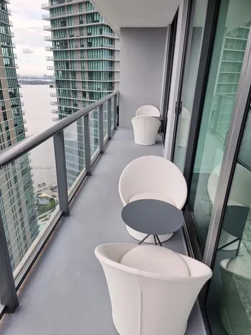 a bathroom with a sink a toilet a mirror and shower