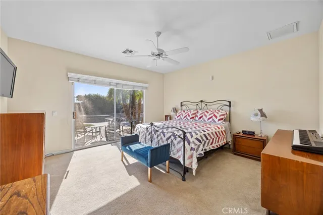 a bed room with a bed and a couch