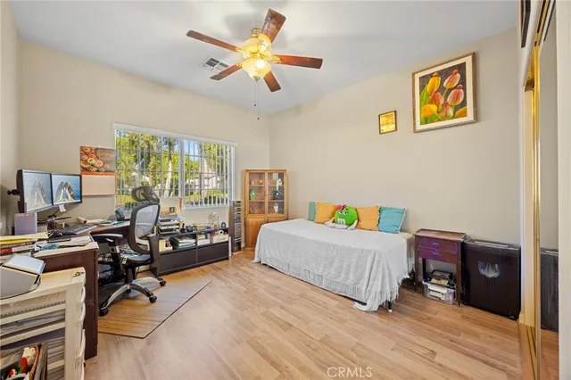 a room with a bed furniture and a window