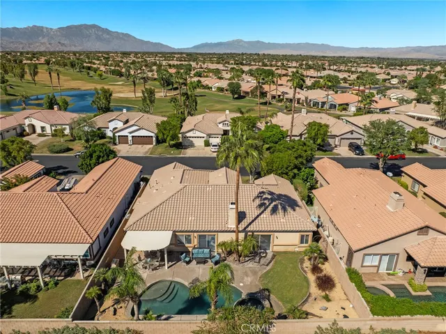 an aerial view of a house with a garden