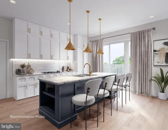 a kitchen with a stove a sink a kitchen island with a dining table and chairs