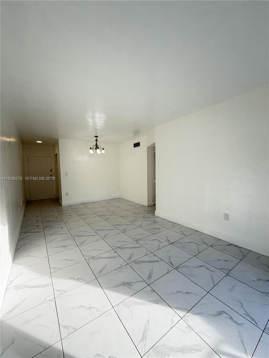 1860 Southwest 22nd Street, Unit 8 Miami, FL 33145 - Photo 4 of 10 a view of a livingroom with a cabinets