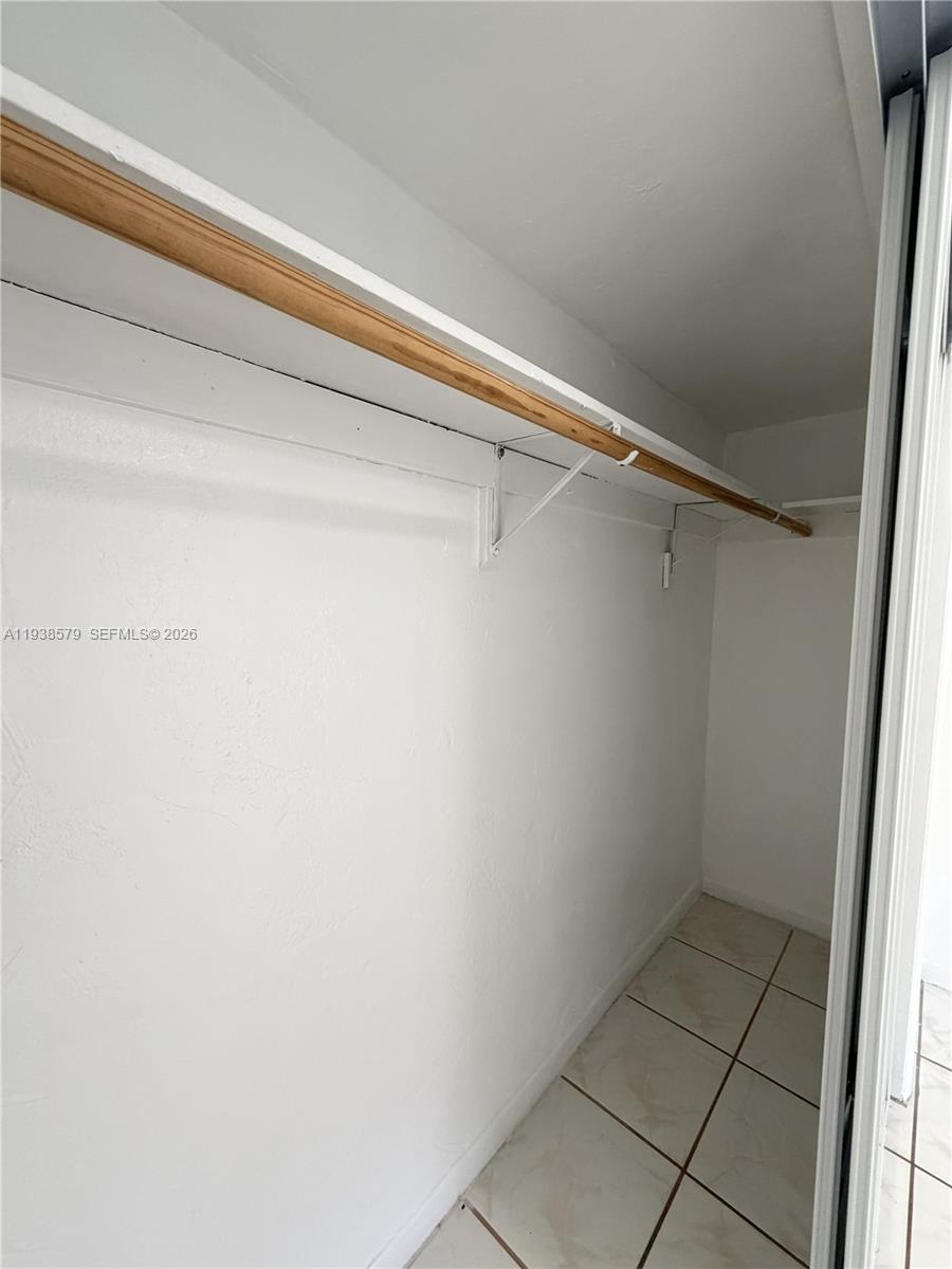 1860 Southwest 22nd Street, Unit 8 Miami, FL 33145 - Photo 8 of 10 a view of a room with racks on the wall