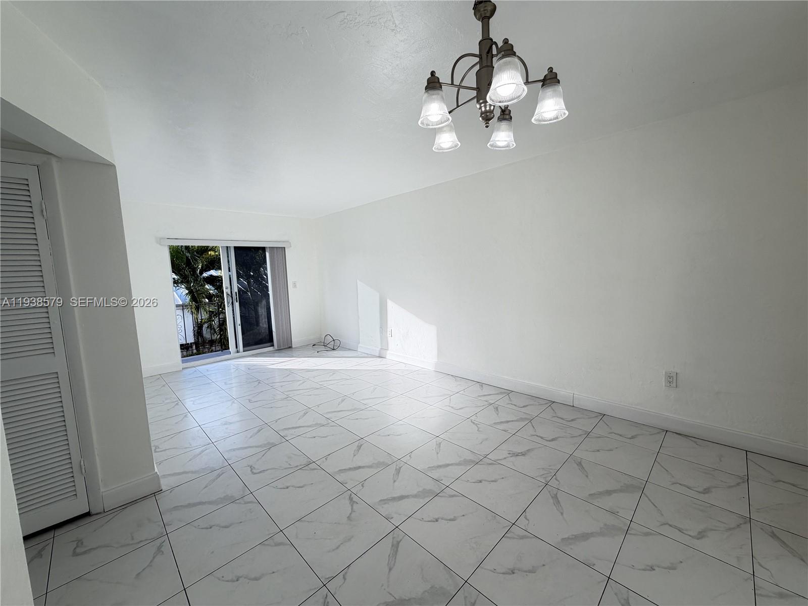 1860 Southwest 22nd Street, Unit 8 Miami, FL 33145 - Photo 9 of 10 wooden floor in an empty room