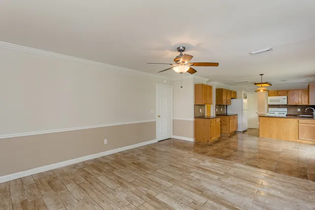 a view of an empty room with windows