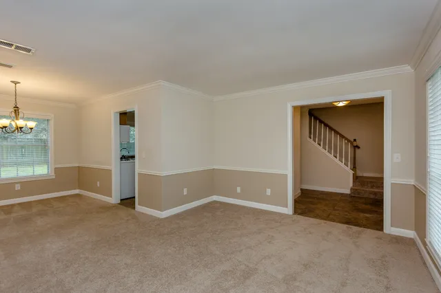 wooden floor in an empty room with a fireplace