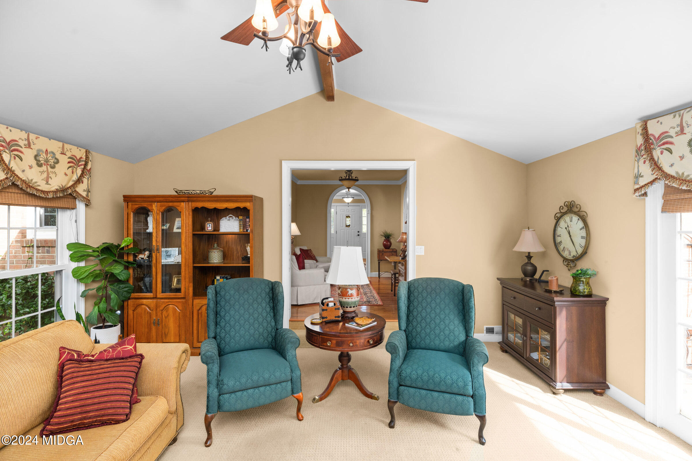 552 Plantation Road Gray, GA 31032 - Photo 12 of 38 a living room with furniture a chandelier and a window