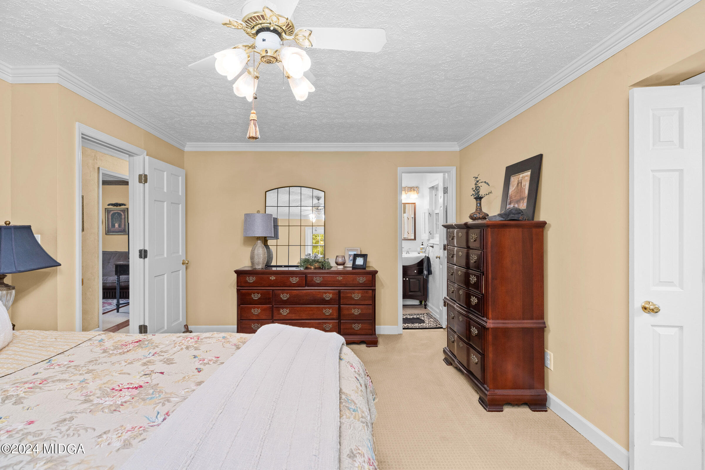 552 Plantation Road Gray, GA 31032 - Photo 20 of 38 a bedroom with bed and wooden floor