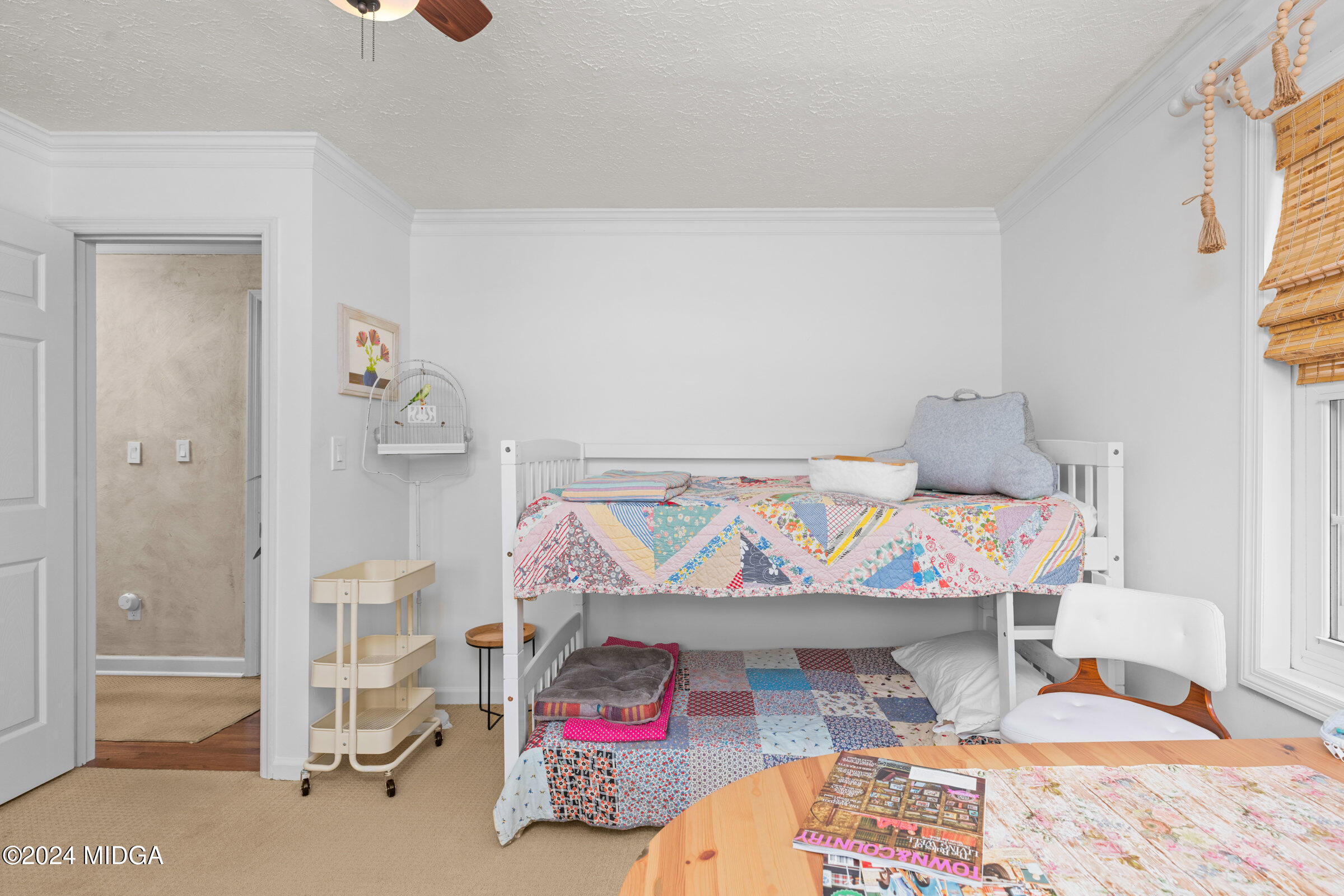 552 Plantation Road Gray, GA 31032 - Photo 26 of 38 a bedroom with a bed and wooden floor