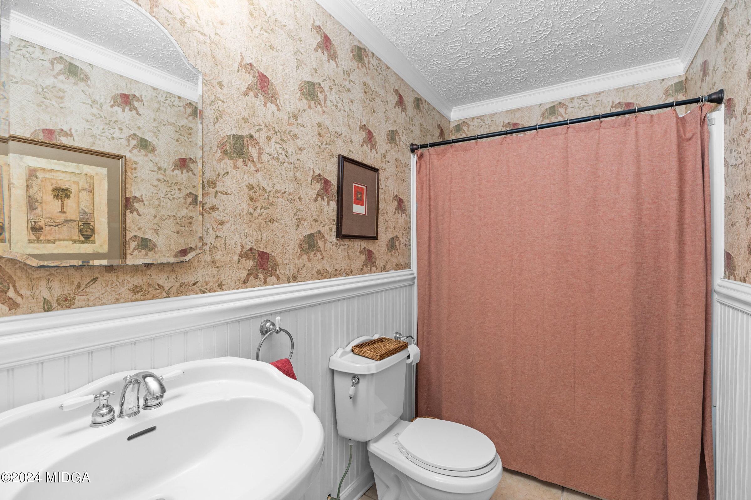 552 Plantation Road Gray, GA 31032 - Photo 27 of 38 a bathroom with a sink a toilet and shower curtain