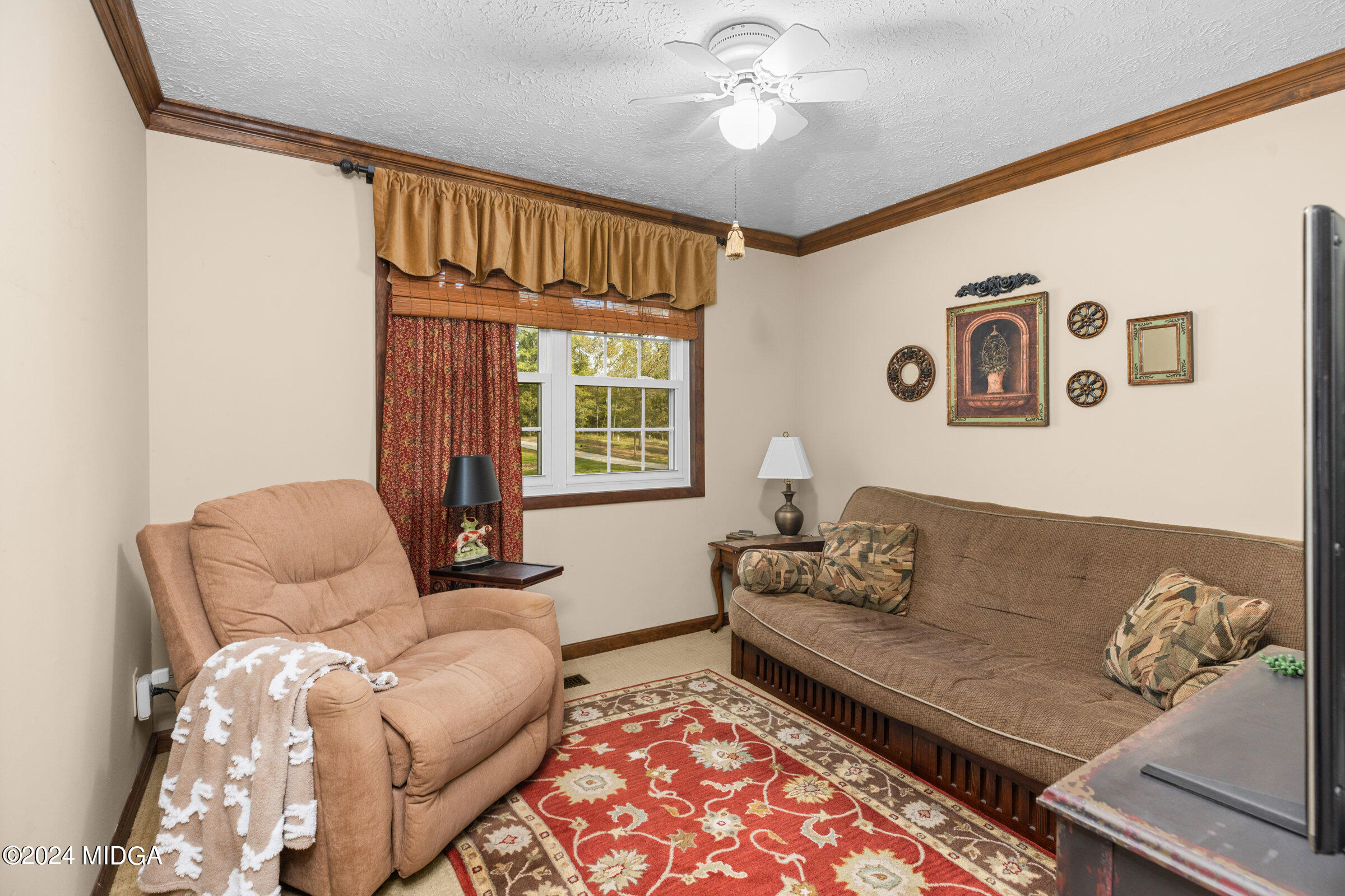 552 Plantation Road Gray, GA 31032 - Photo 28 of 38 a living room with furniture and a window