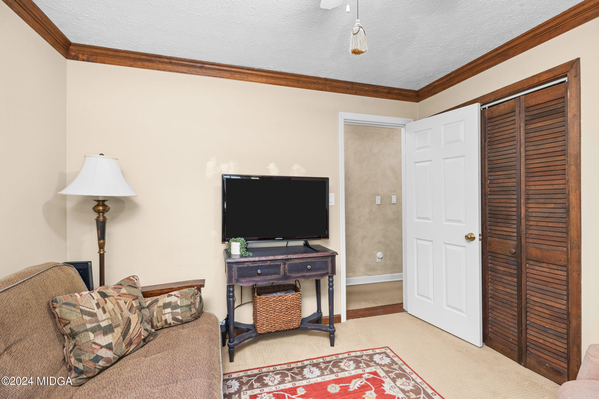 552 Plantation Road Gray, GA 31032 - Photo 29 of 38 a living room with furniture and a flat screen tv