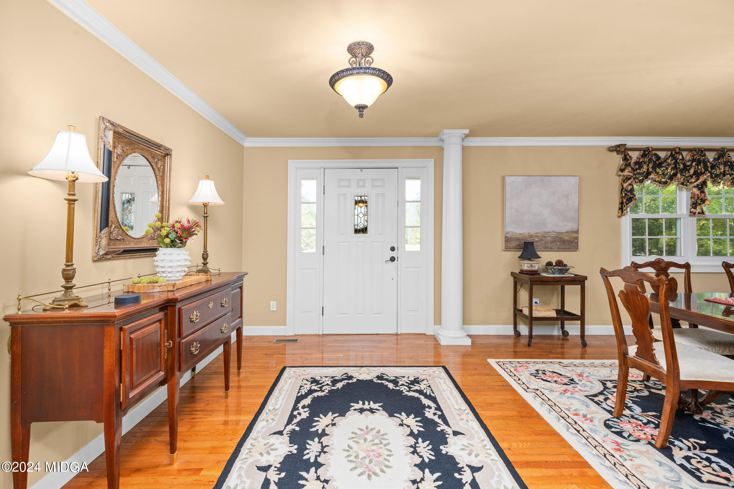 552 Plantation Road Gray, GA 31032 - Photo 3 of 38 a spacious bedroom with a bed and wooden floor