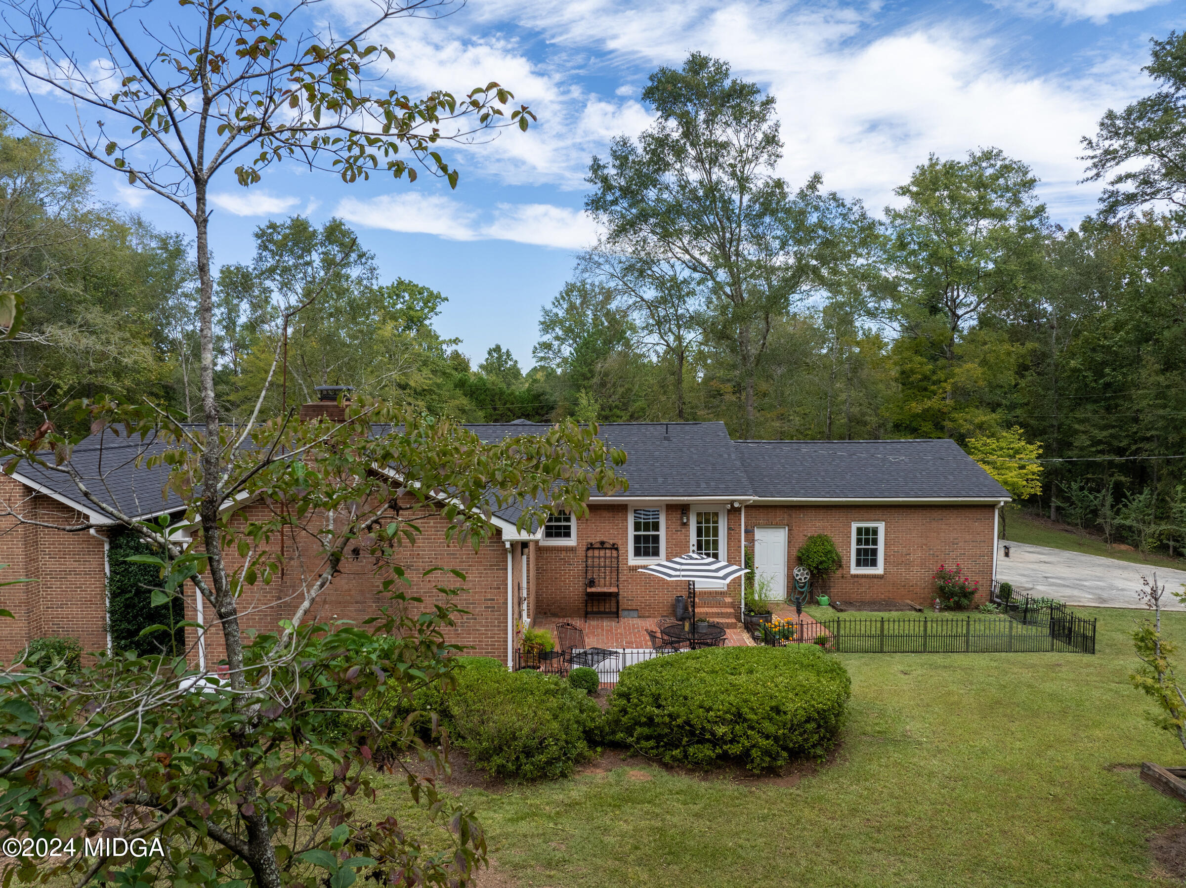 552 Plantation Road Gray, GA 31032 - Photo 32 of 38 a front view of a house with a garden