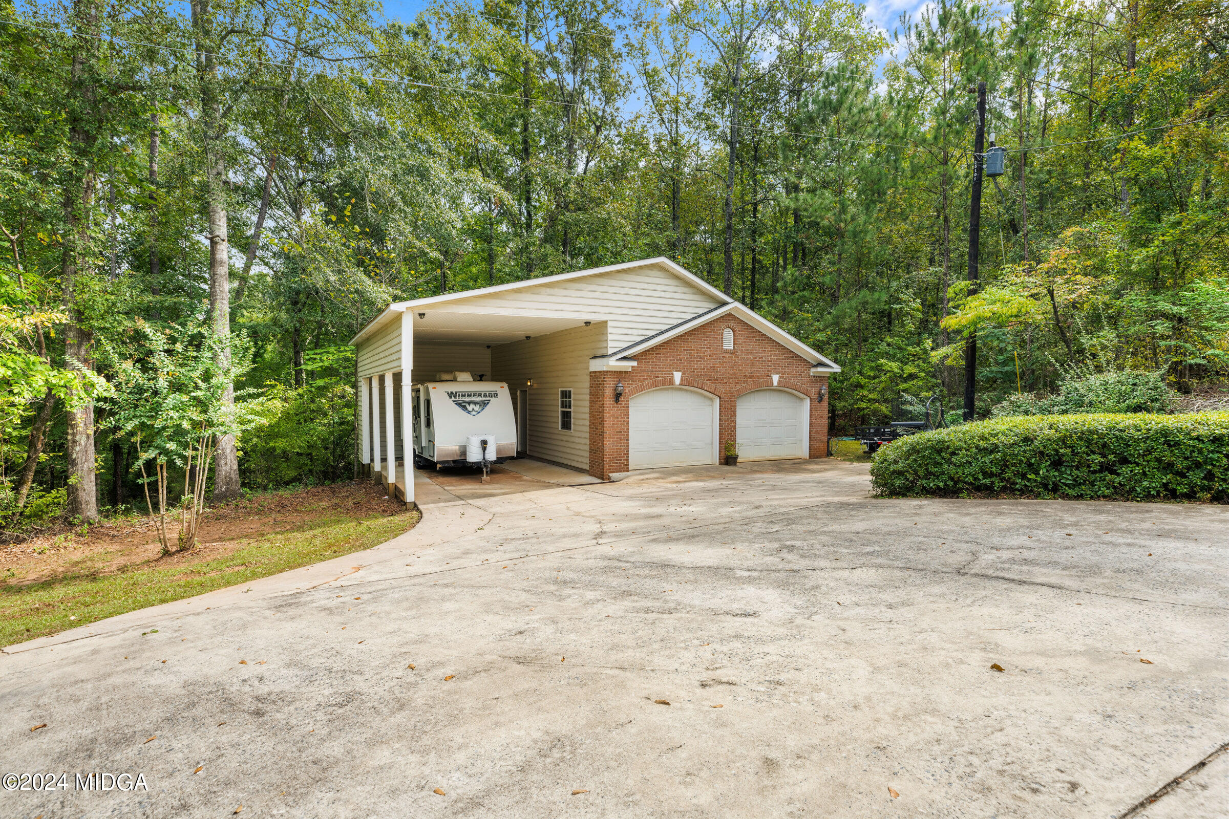 552 Plantation Road Gray, GA 31032 - Photo 33 of 38 a front view of a house with a yard and garage
