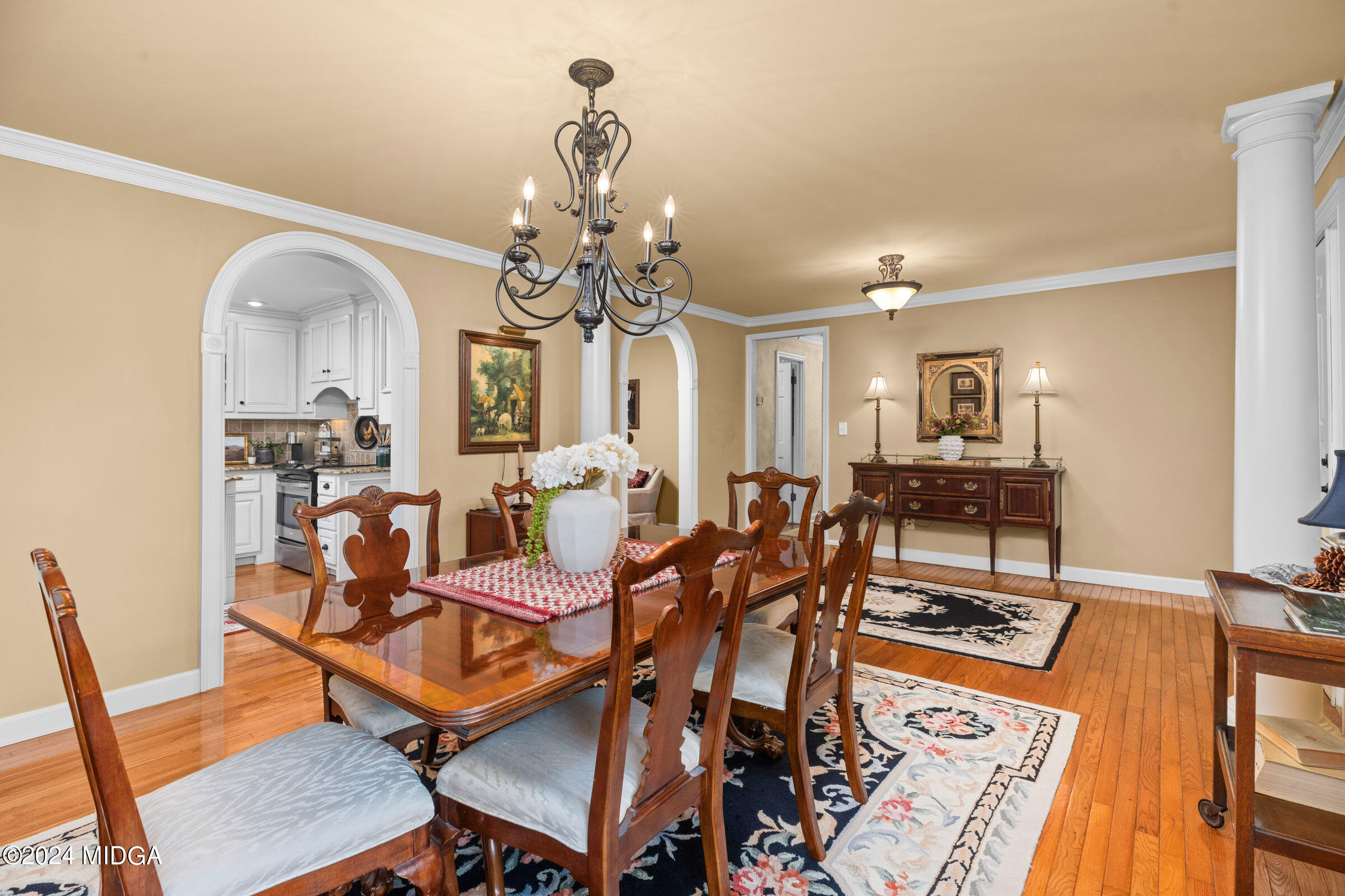 552 Plantation Road Gray, GA 31032 - Photo 6 of 38 a view of a dining room with furniture and wooden floor