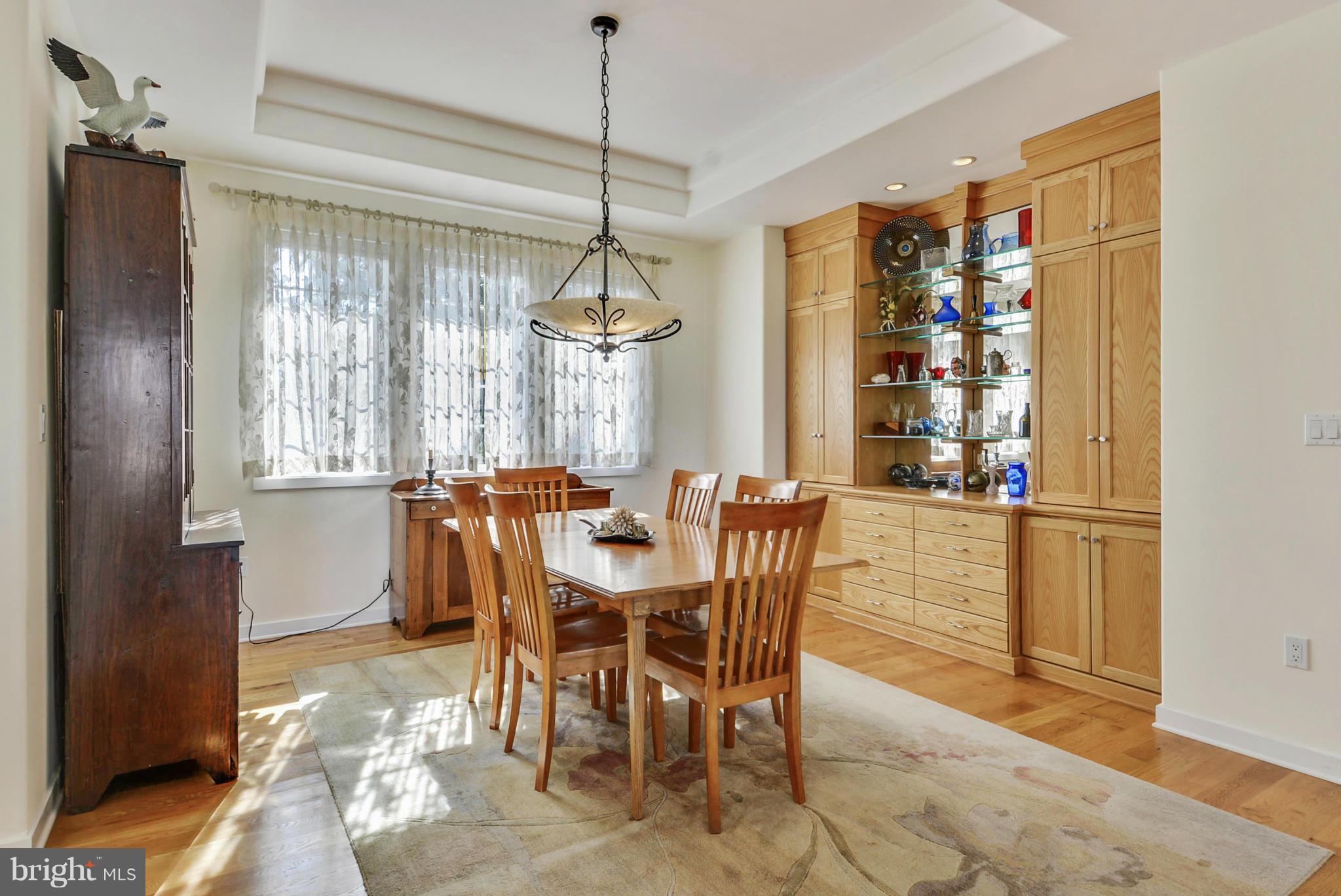 1690 Cox Neck Road Chester, MD 21619 - Photo 14 of 28 a view of a dining room with furniture window and wooden floor
