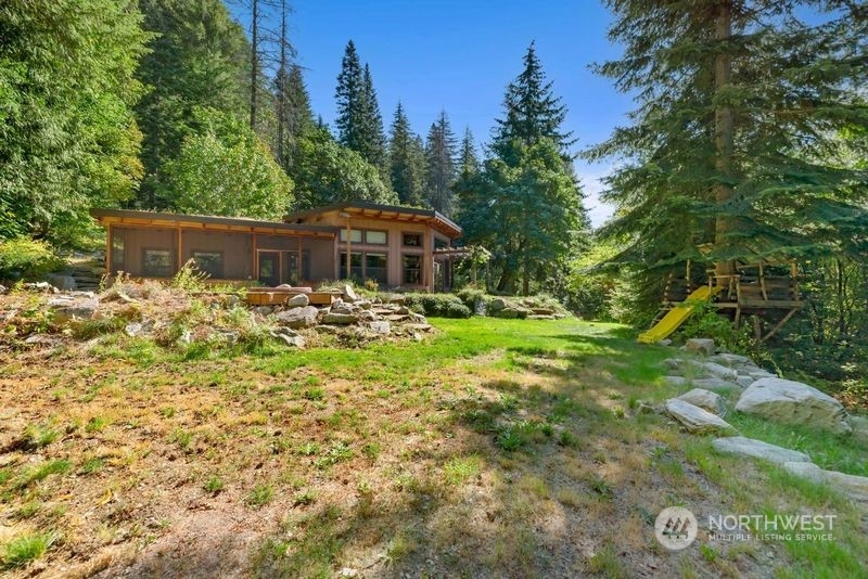 23510 White River Road Leavenworth, WA 98826 - Photo 1 of 39 a view of a house with a yard