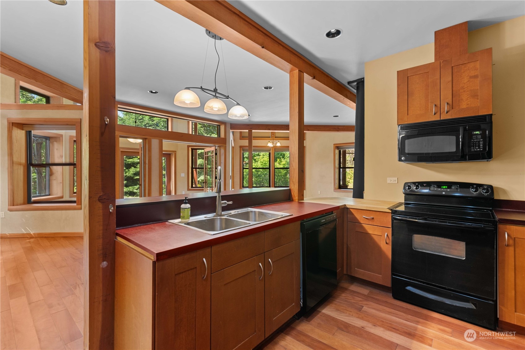 23510 White River Road Leavenworth, WA 98826 - Photo 27 of 39 a kitchen with a sink stove and microwave