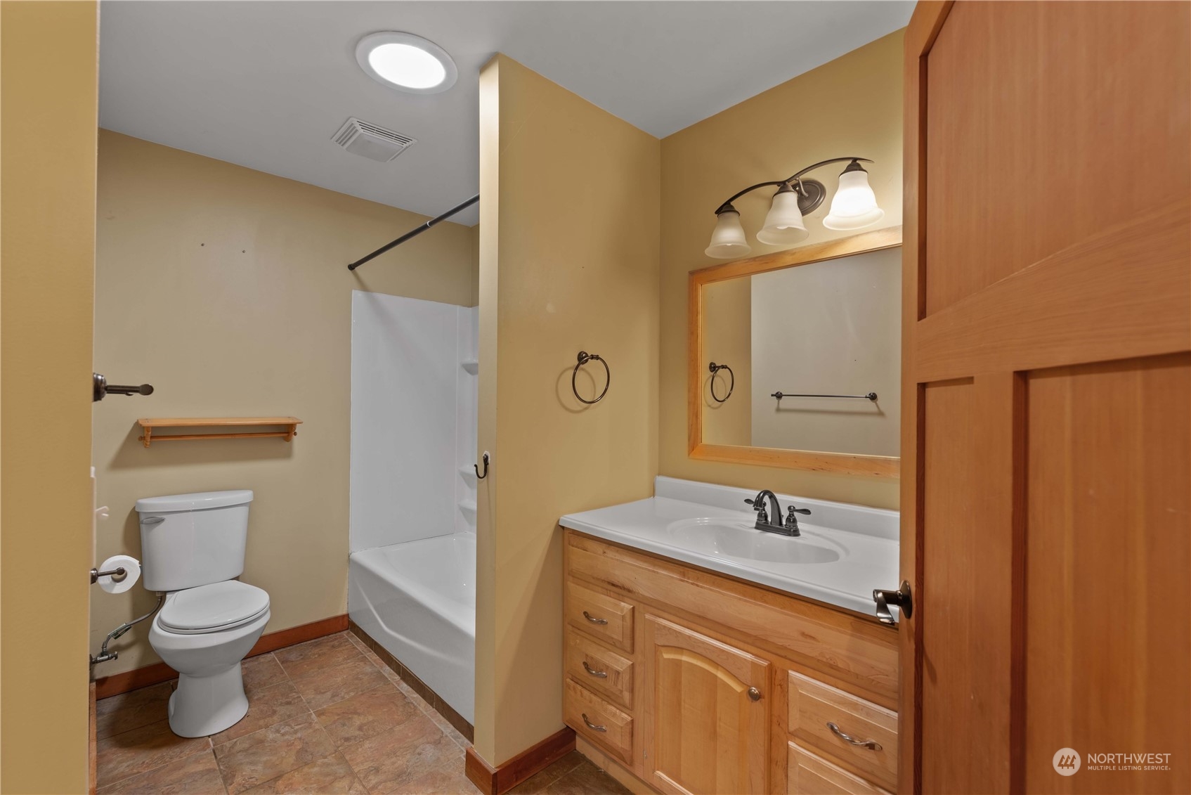 23510 White River Road Leavenworth, WA 98826 - Photo 37 of 39 a bathroom with a toilet sink and mirror