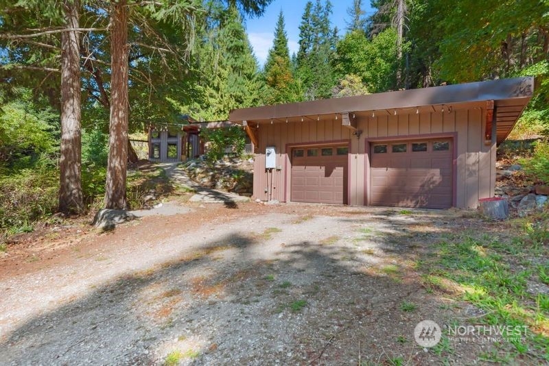 23510 White River Road Leavenworth, WA 98826 - Photo 10 of 39 a view of a house with a yard and tree