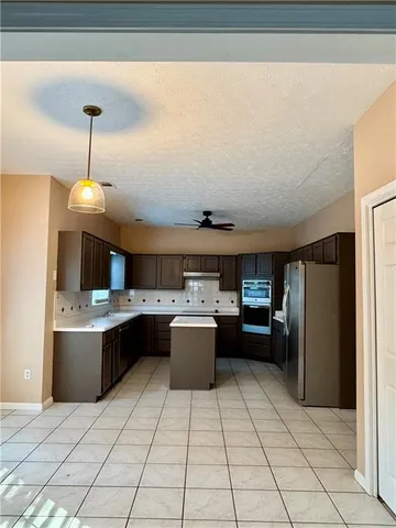 a kitchen with a cabinets and counter space