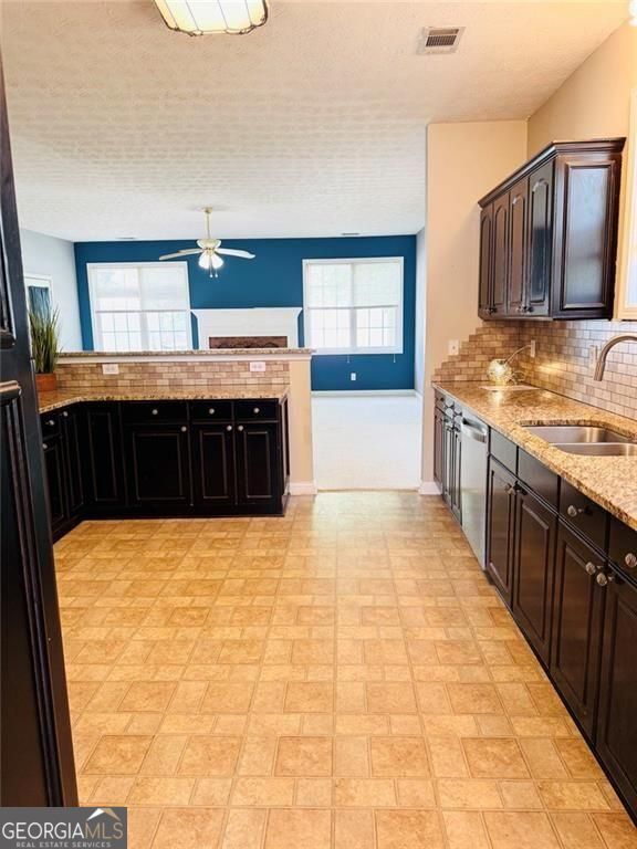 543 Saddle Ridge Drive Bethlehem, GA 30620 - Photo 13 of 36 a view of a kitchen with stainless steel appliances granite countertop a stove a sink dishwasher and cabinets
