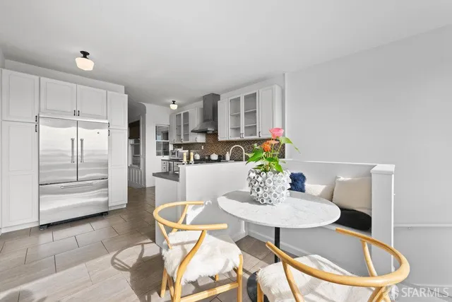 a backyard of a house with outdoor seating